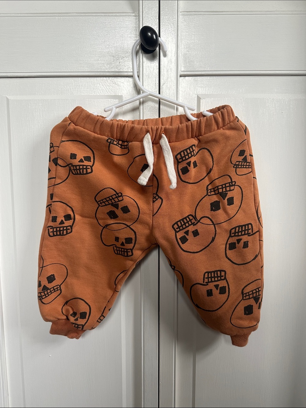 Zara Rust Orange Joggers with Black Skull Print